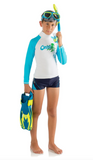 Child wearing a swimsuit with a shark design, holding snorkel and flippers on a white background